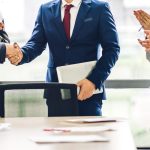 Image two business partners in elegant suit successful handshake