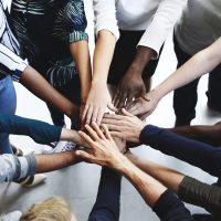 Diversity teamwork with joined hands Diversity teamwork with joined hands